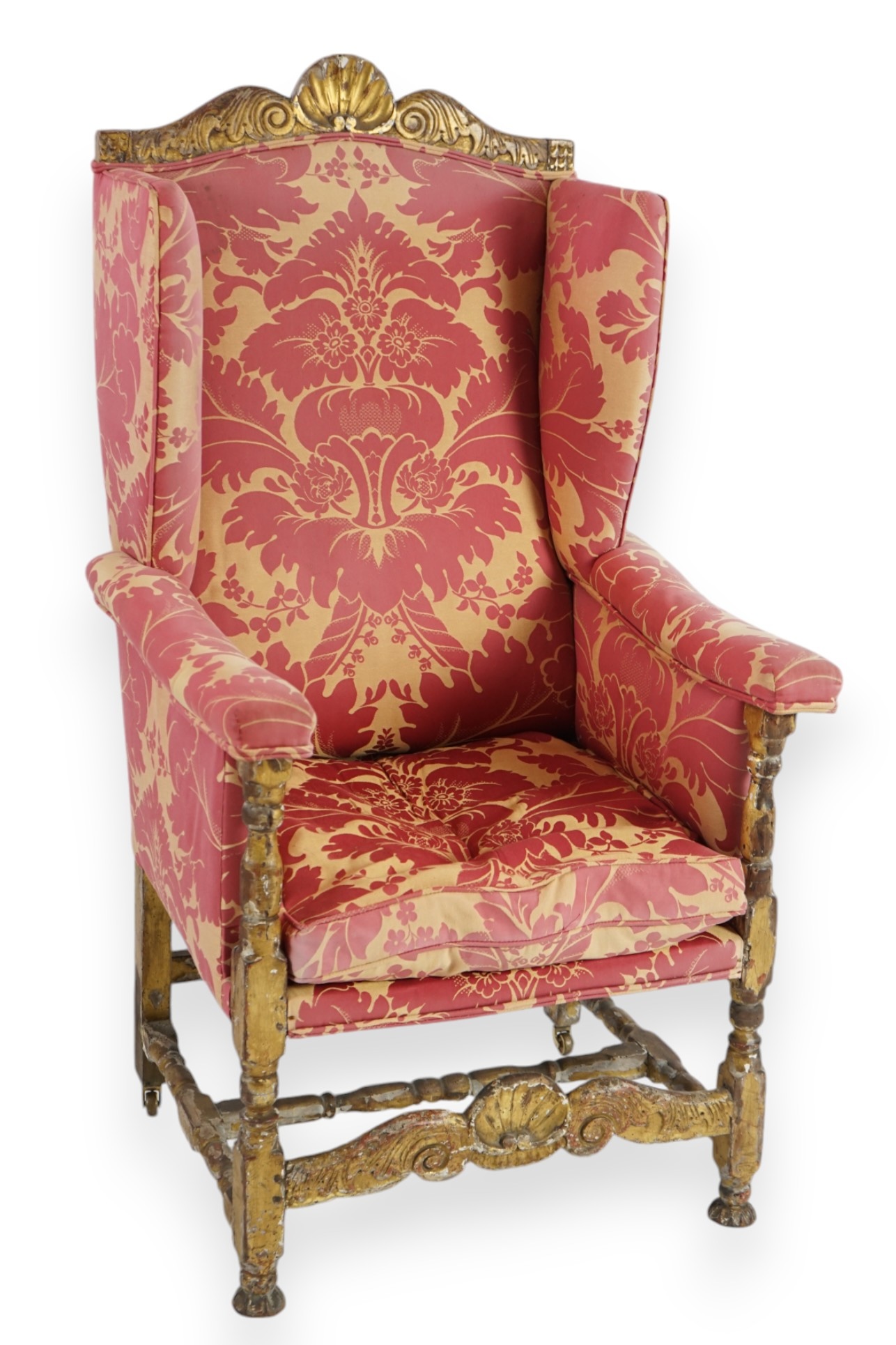 A Louis XIV style giltwood wing armchair